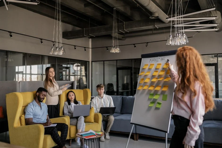 Sticky notes with holiday marketing ideas for Christmas social media and email campaigns.